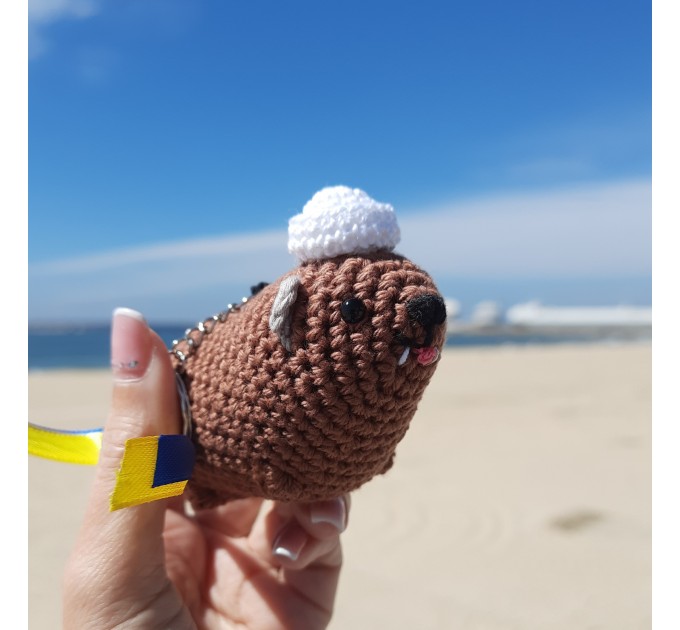 Adorable handmade crochet Awawa wearing a graduation cap, navy cap, or Luffy straw hat, cute hyrax keychain, bag charm, or rear view mirror charm gift