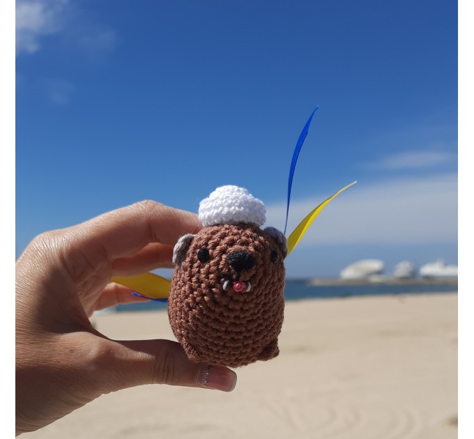 Adorable handmade crochet Awawa wearing a graduation cap, navy cap, or Luffy straw hat, cute hyrax keychain, bag charm, or rear view mirror charm gift