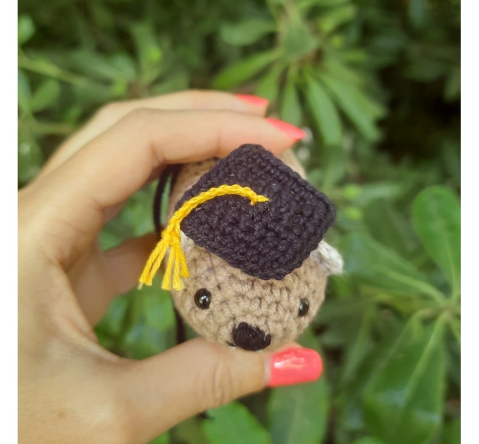 Adorable handmade crochet Awawa wearing a graduation cap, navy cap, or Luffy straw hat, cute hyrax keychain, bag charm, or rear view mirror charm gift