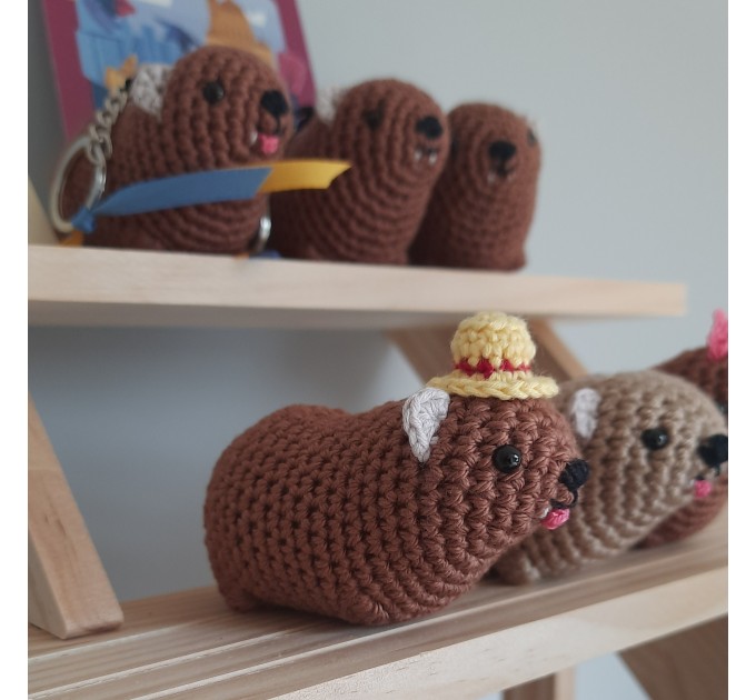 Adorable handmade crochet Awawa wearing a graduation cap, navy cap, or Luffy straw hat, cute hyrax keychain, bag charm, or rear view mirror charm gift