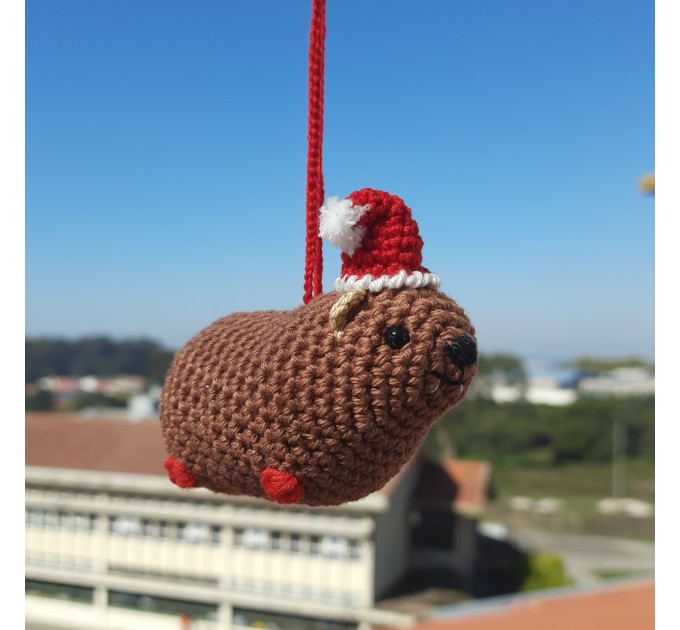 Christmas style Awawa wearing Xmas sweater, hat or reindeer, cute crochet Hyrax keychain, bag charm or rear view mirror car accessory